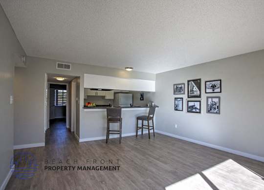 A kitchen area with a dining table and chairs.
