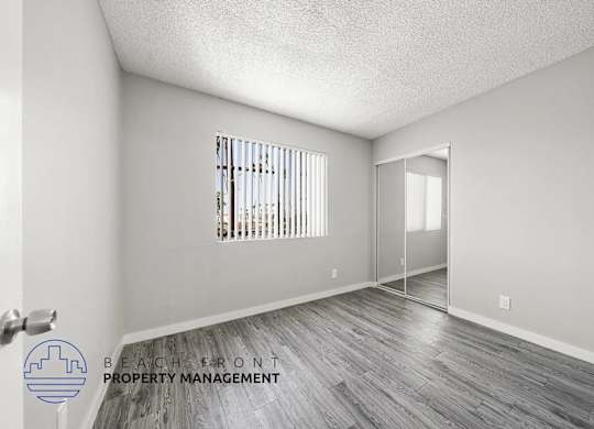 A room with a window and a door is shown in the image.
