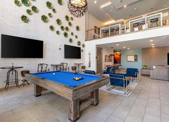 play a game of pool in our game room at our apartments