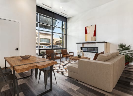 a living room with a couch and a table and a fireplace