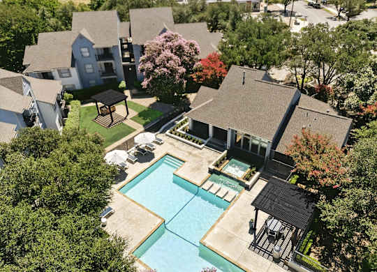 A large house with a pool in the backyard.