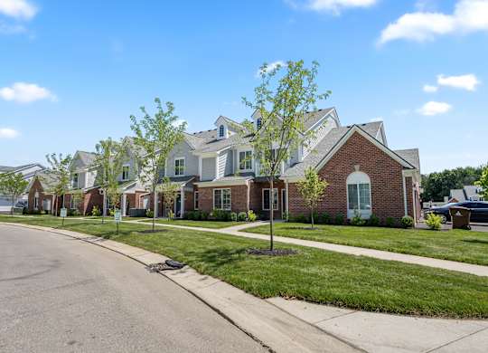a row of houses on the side of a street