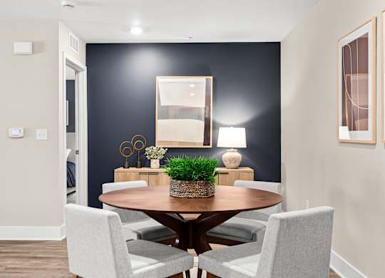a dining room with a table and chairs