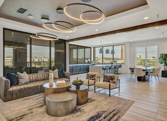 A modern living room with a large window and a view of the city.