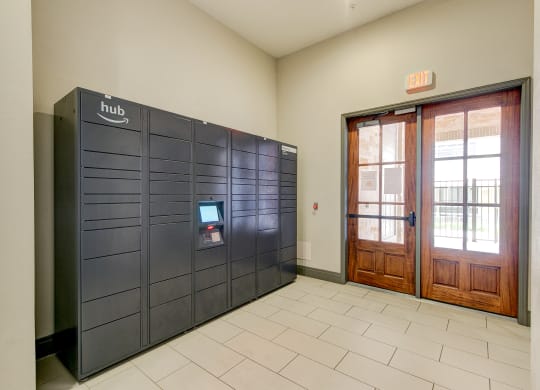 the lobby of a building with a door and a locker