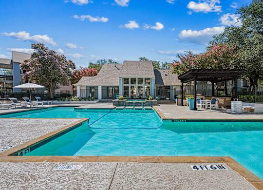 A swimming pool with a depth marker reading 4FT 6IN.