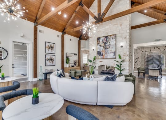 a living room with a white couch and a fireplace