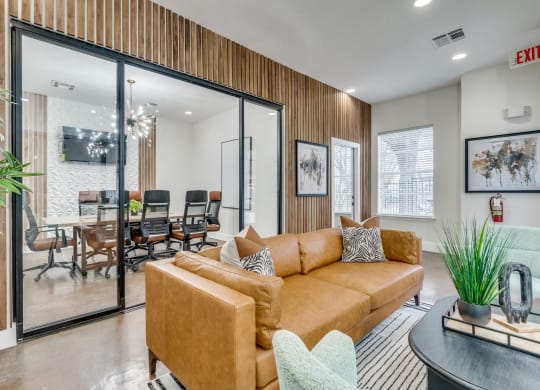a living room with a couch and a table with chairs
