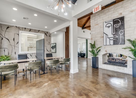 a dining room with a table and chairs and a fireplace