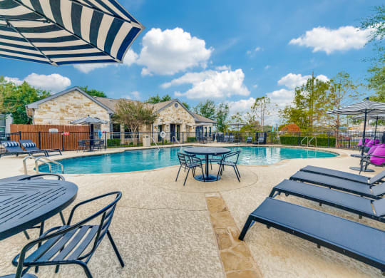 the preserve at ballantyne commons pool and tables with umbrellas