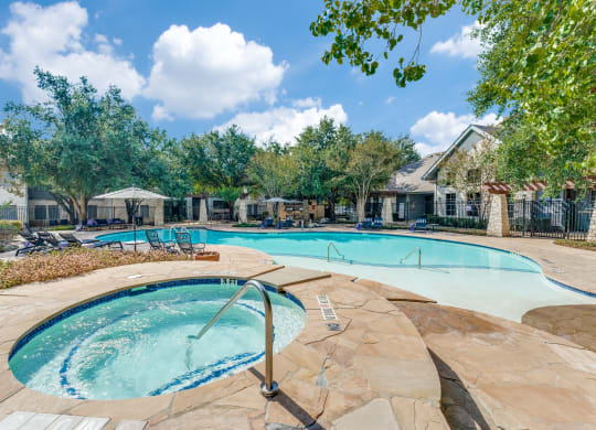 the preserve at ballantyne commons pool and spa with trees and a pool house