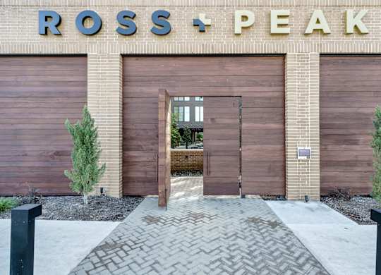 A building with a sign that says Ross + Peak.