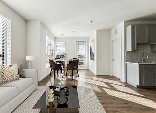 A modern living room with a white couch and a coffee table.
