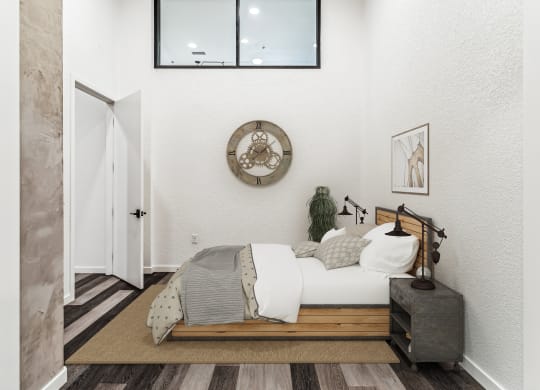 a bedroom with a bed and a mirror on the wall