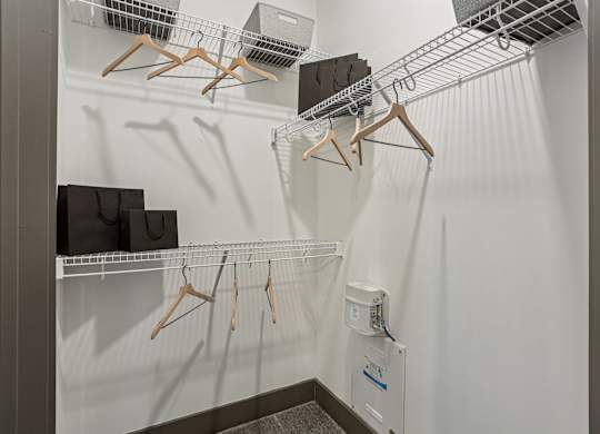 Closet with hangers and shelves.