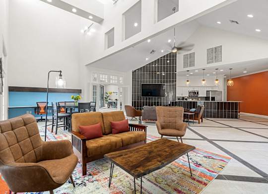 A living room with a brown chair and a brown couch.