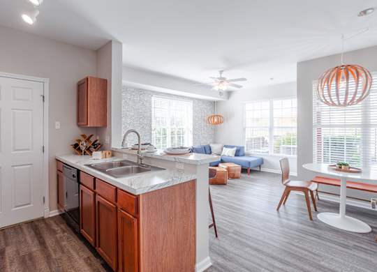 A kitchen with a sink and a counter.