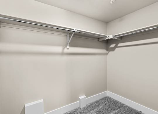 an empty garage with white walls and a white garage door