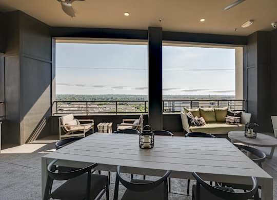 A modern dining room with a table set for six.