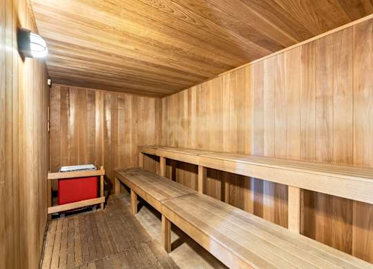 a wooden sauna with benches and a table