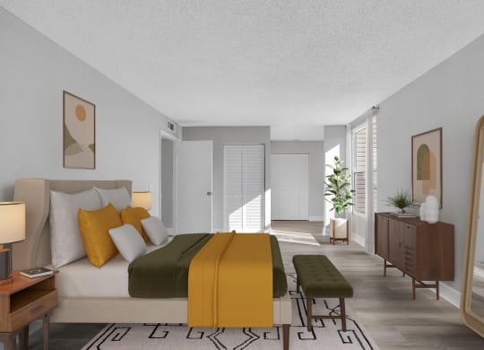 a bedroom with a bed and a yellow blanket