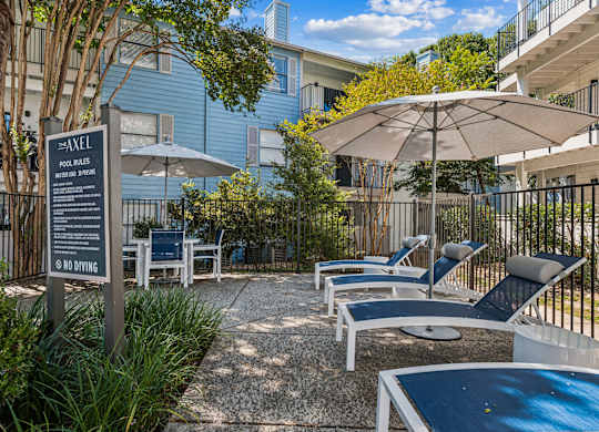 A pool area with a sign that says