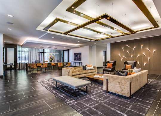 A spacious living room with a large couch and a coffee table.