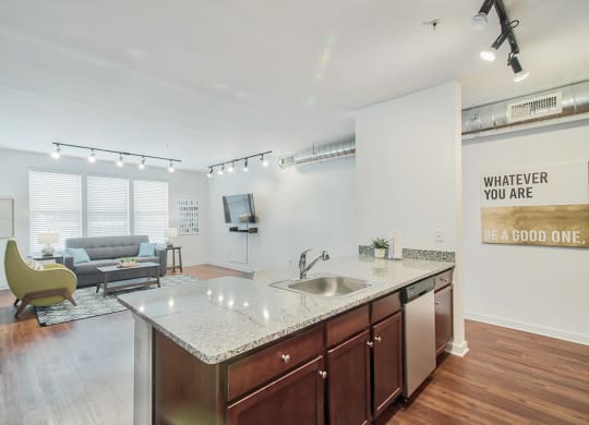 kitchen with an island and a living room in the background