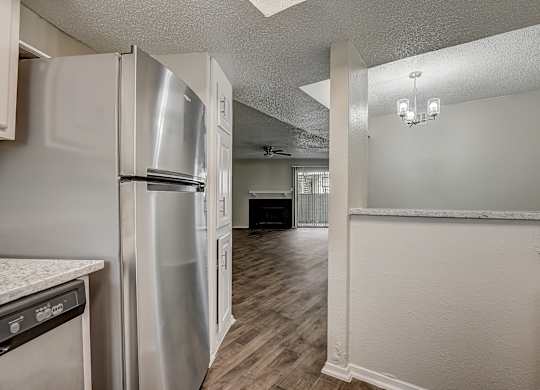 a kitchen and living room in an apartment