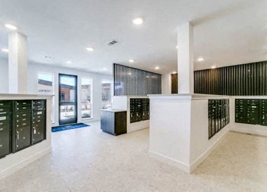 A white reception area with black and white striped walls.