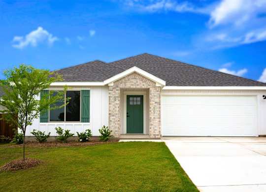 A house with a green door and a grey roof.