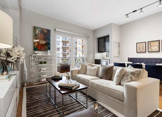 a living room with a white couch and a coffee table
