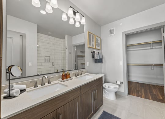 a bathroom with a sink and a toilet and a mirror