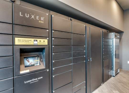 A row of lockers with a sign that says LuxeR on the top left.