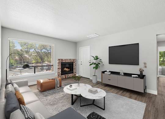 A modern living room with a fireplace and a flat screen TV.