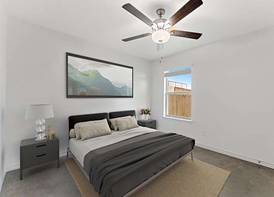 A bedroom with a bed, nightstand, and a painting on the wall.