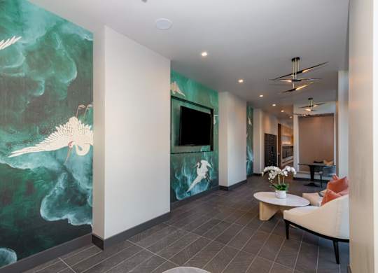 A room with a large painting of a bird on the wall.
