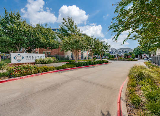 A sign for Halcyon Castle is visible in front of a building.