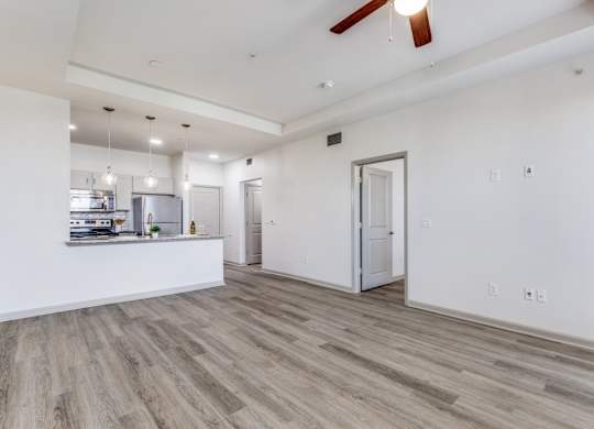 A room with a white ceiling and a wooden floor.