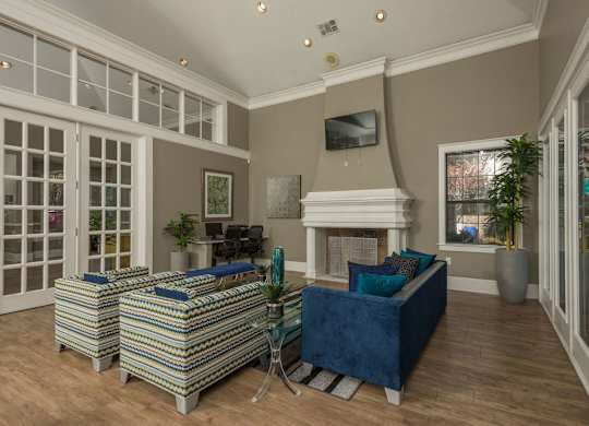 a living room with couches and a fireplace