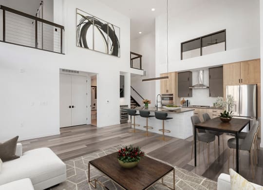 a living room with a kitchen and a dining room
