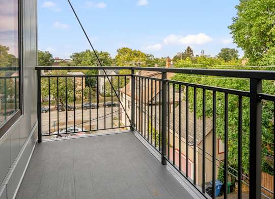 the view from the balcony of a home with a balcony guard rail