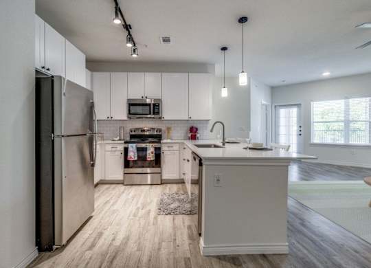 the preserve at ballantyne commons apartment kitchen with stainless steel appliances