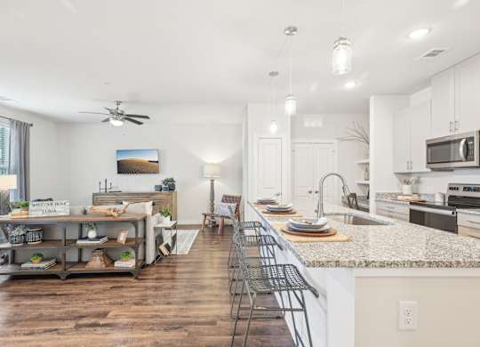 A kitchen with a counter and a sink.
