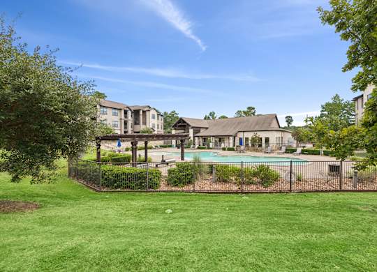 A large house with a pool in the backyard.