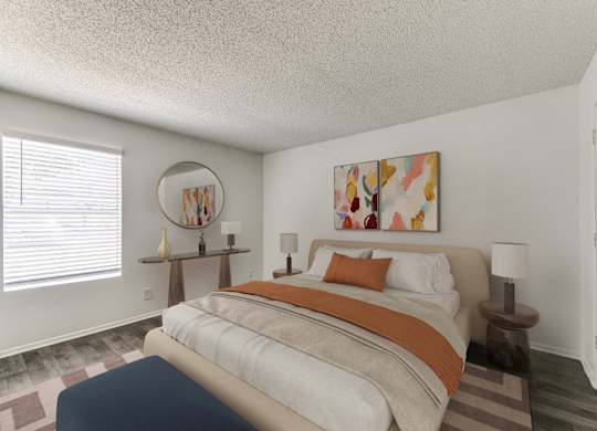 a bedroom with a bed with an orange and white comforter