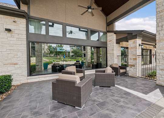 A patio with a table and chairs is shown.