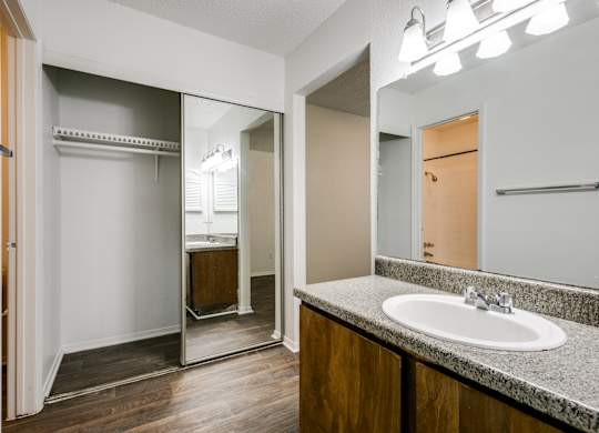 the interior of a bathroom with a sink and a mirror