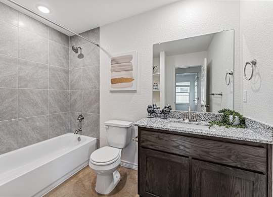 a bathroom with a sink toilet and a bath tub