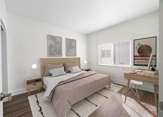 A bedroom with a bed, desk, and chair.